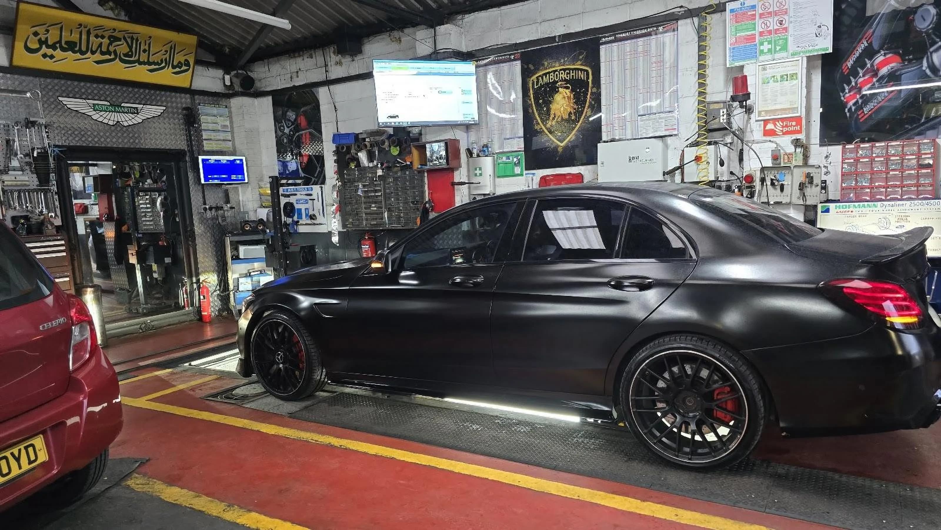 Car being serviced inside the Bismillah Garage Luton workshop